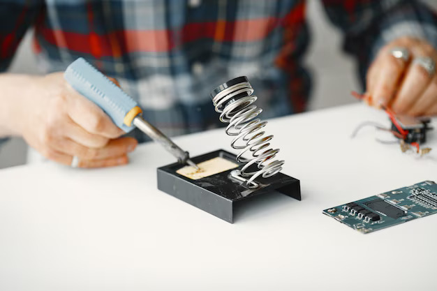 senior-man-with-equipment-soldering-working-home_1157-47192.jpg